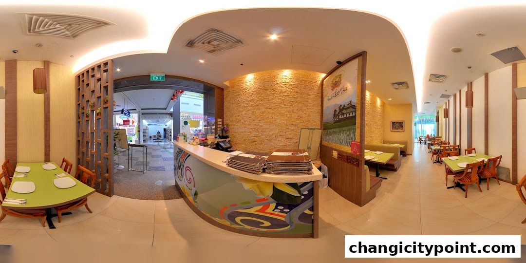 Interior view of Pondok Kartika restaurant with tables, seating, and a reception counter.