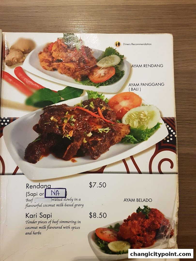 A menu page from Pondok Kartika featuring Indonesian dishes like Rendang and Kari Sapi.