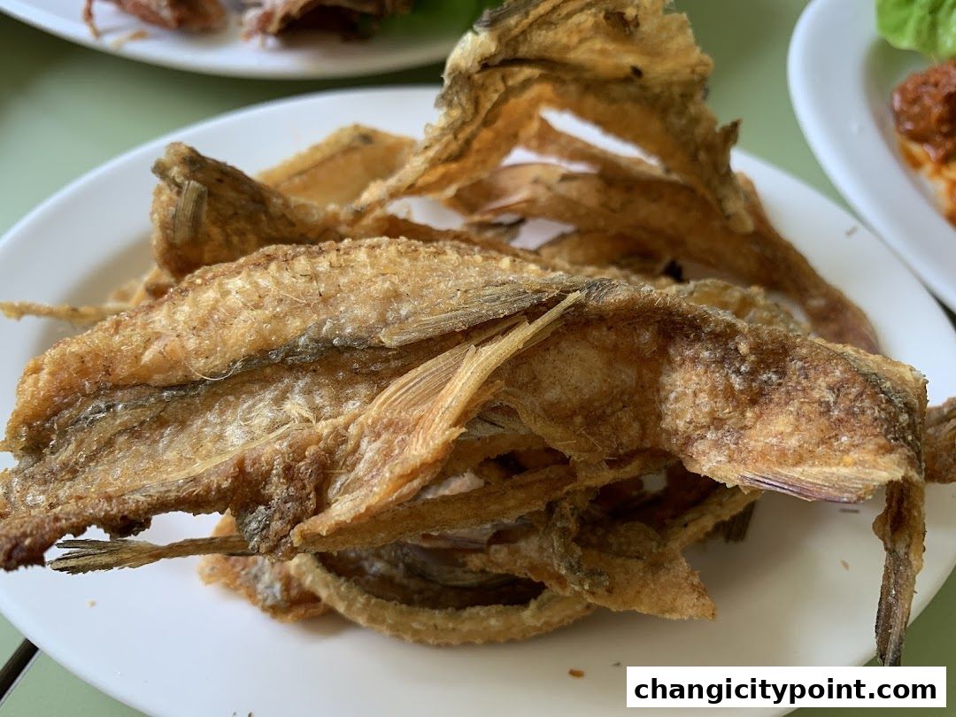 A close-up of a plate of crispy fried fish, a delicious seafood dish.