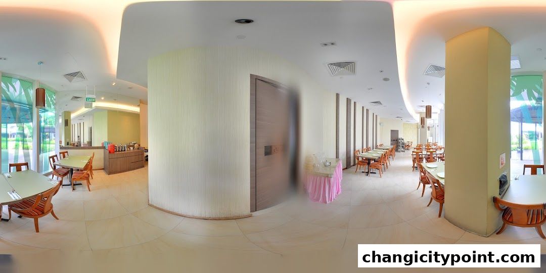 Interior view of a restaurant with tables, chairs, and a buffet counter.