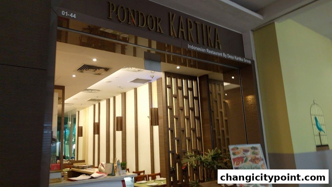 The entrance of Pondok Kartika, an Indonesian restaurant, with its signage and interior visible.