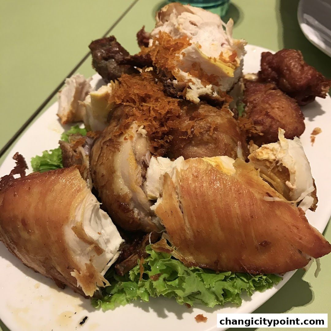 A platter of delicious, freshly carved roasted chicken served with lettuce.