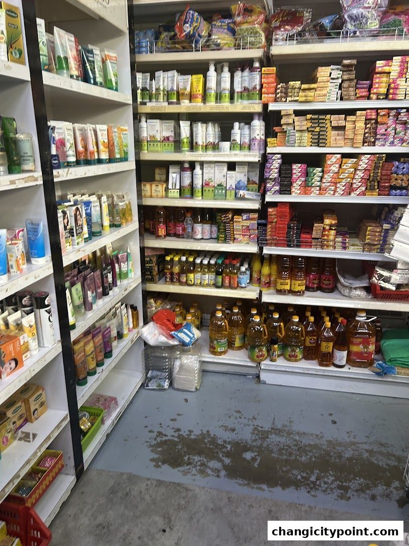 Shelves stocked with Indian groceries, personal care items, and cooking oils.