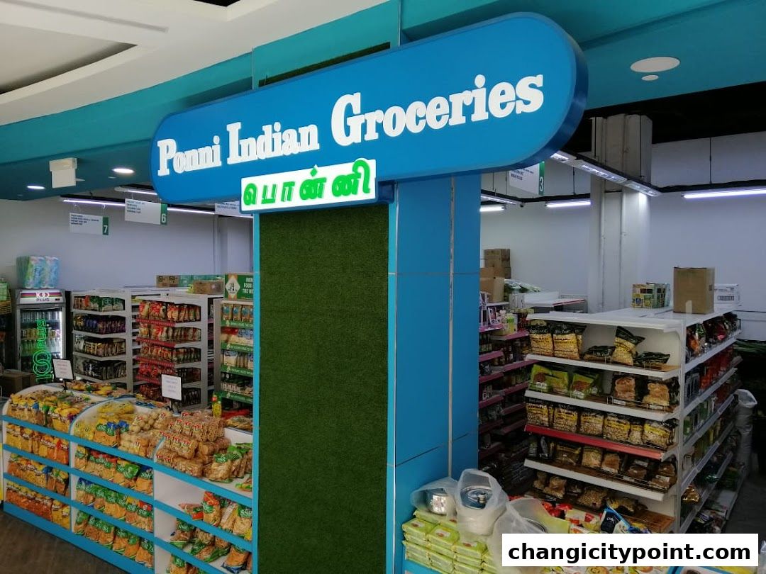 Interior view of Ponni Indian Groceries shop with shelves stocked with various food items.