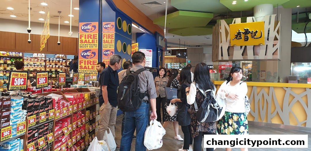 Customers browse a grocery store with prominent "Fire Sale" signs and various products on display.