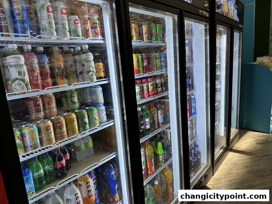 Refrigerated display cases filled with a variety of beverages and drinks.