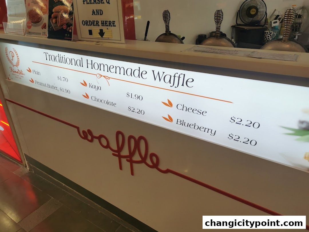 A menu board displaying traditional homemade waffles with various flavors and prices.