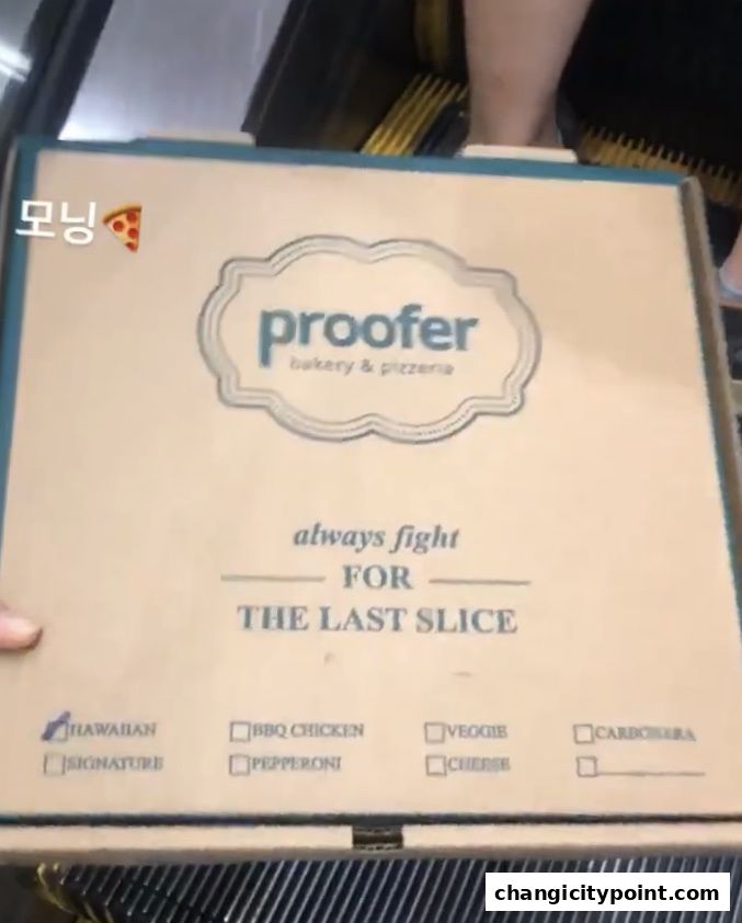 A Proofer Bakery & Pizzeria pizza box with various topping options listed.