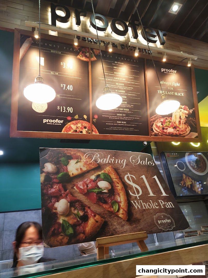 A menu board for Proofer Bakery & Pizzeria, showcasing gourmet pizzas and a whole pan special.