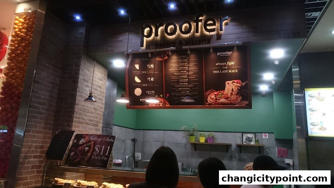 A menu board for Proofer Bakery & Pizzeria displaying pizza options and prices.