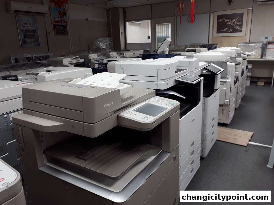 A shop interior filled with various printers and copiers, showcasing a wide selection.