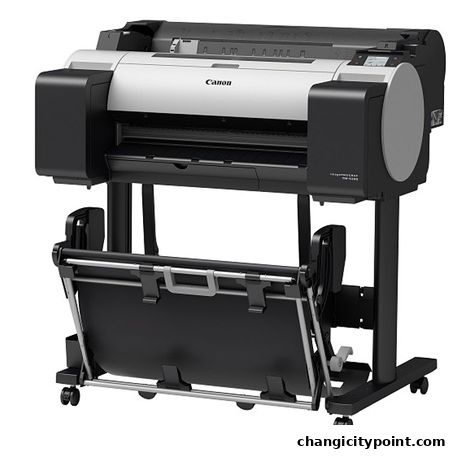 A large Canon imagePROGRAF printer with a roll feeder on a stand.