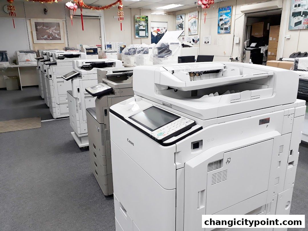 A retail space filled with various models of printers and copiers for rent or lease.