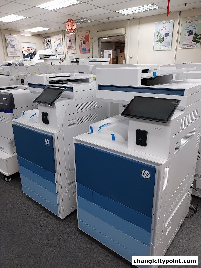 Interior view of a shop displaying multiple printers and copiers.