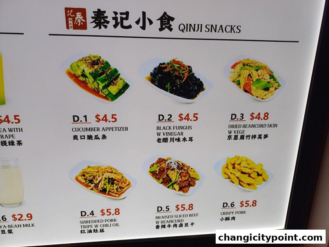 A menu display for Qinji Snacks featuring various appetizers and dishes with prices.