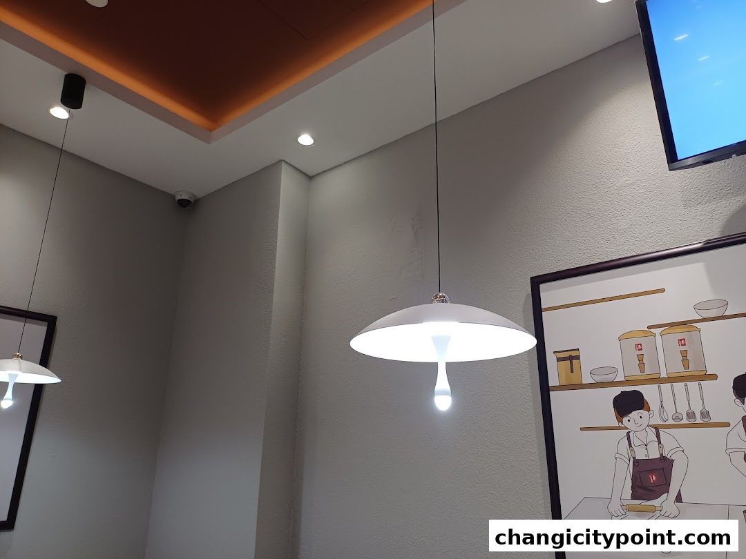 Interior shot of a restaurant with modern lighting and artwork.