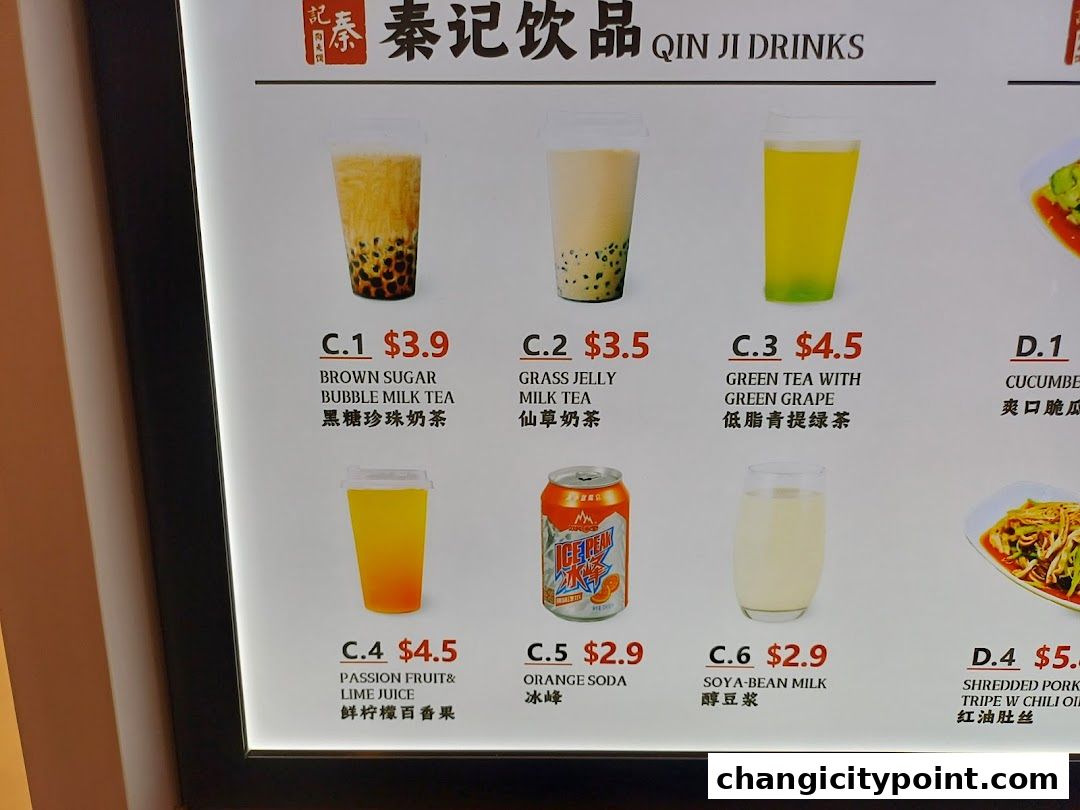 A menu board displaying various drinks and some food items from Qin Ji Drinks.