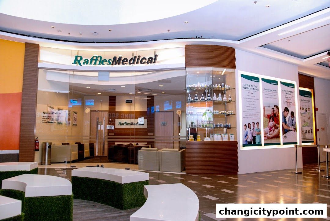 The entrance of Raffles Medical clinic with a reception area and display shelves.