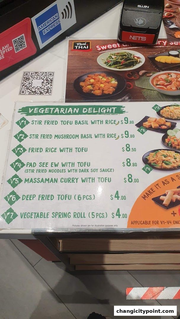 A menu for Real Thai featuring vegetarian delights with prices and descriptions.