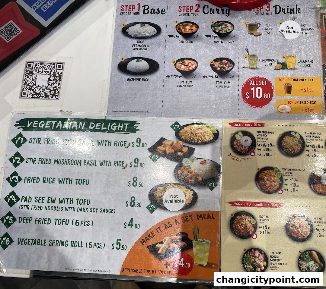 A menu displaying Thai dishes, including vegetarian options, rice, noodles, and set meals.
