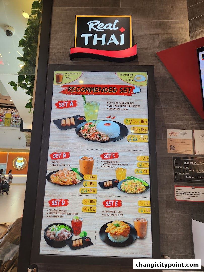 A menu board for Real Thai restaurant featuring recommended sets with food and drinks.