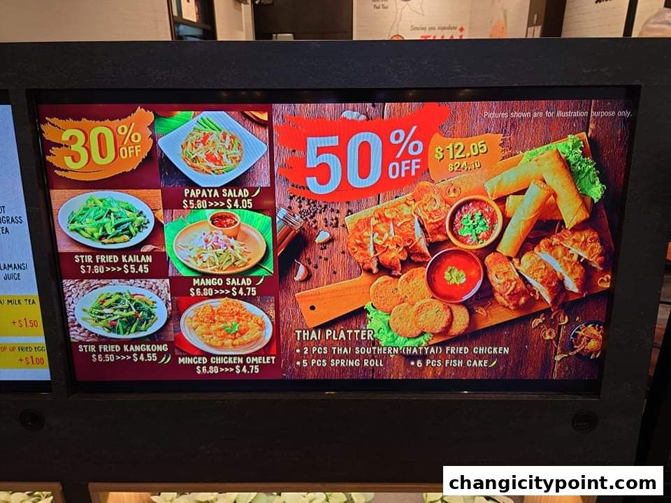 A digital menu board displaying Thai food items with prices and discounts.