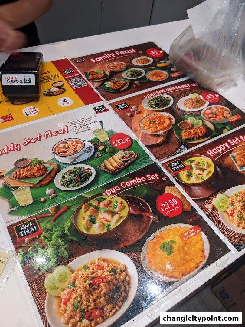 A table displaying various Thai food set meals and combo options from Real Thai.