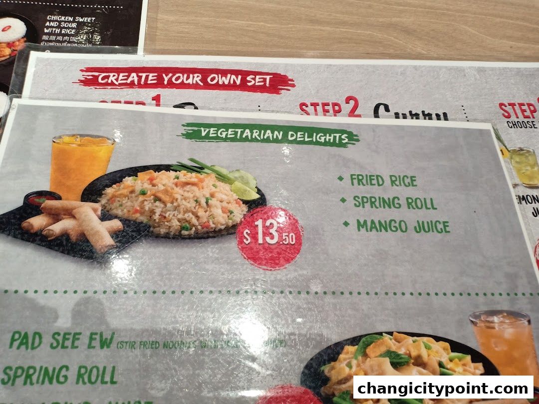 A menu featuring vegetarian delights with fried rice, spring roll, and mango juice.