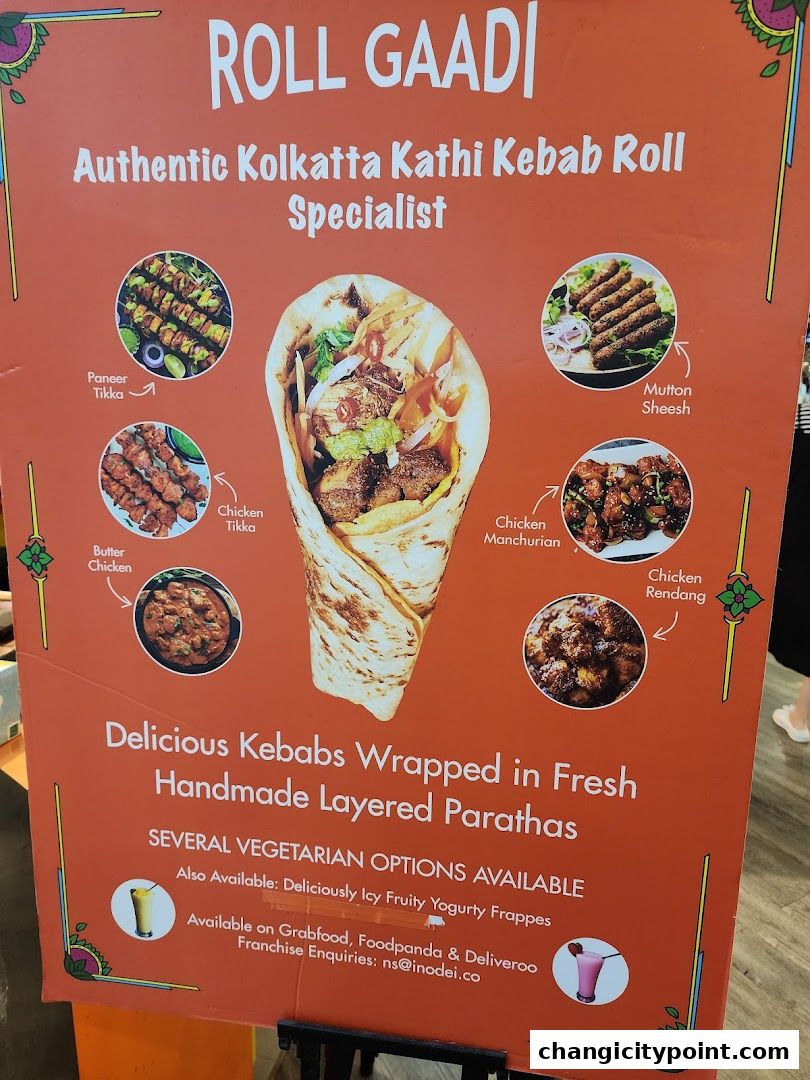 A menu board for Roll Gaadi, specializing in Kolkata Kathi Kebab Rolls with various fillings.