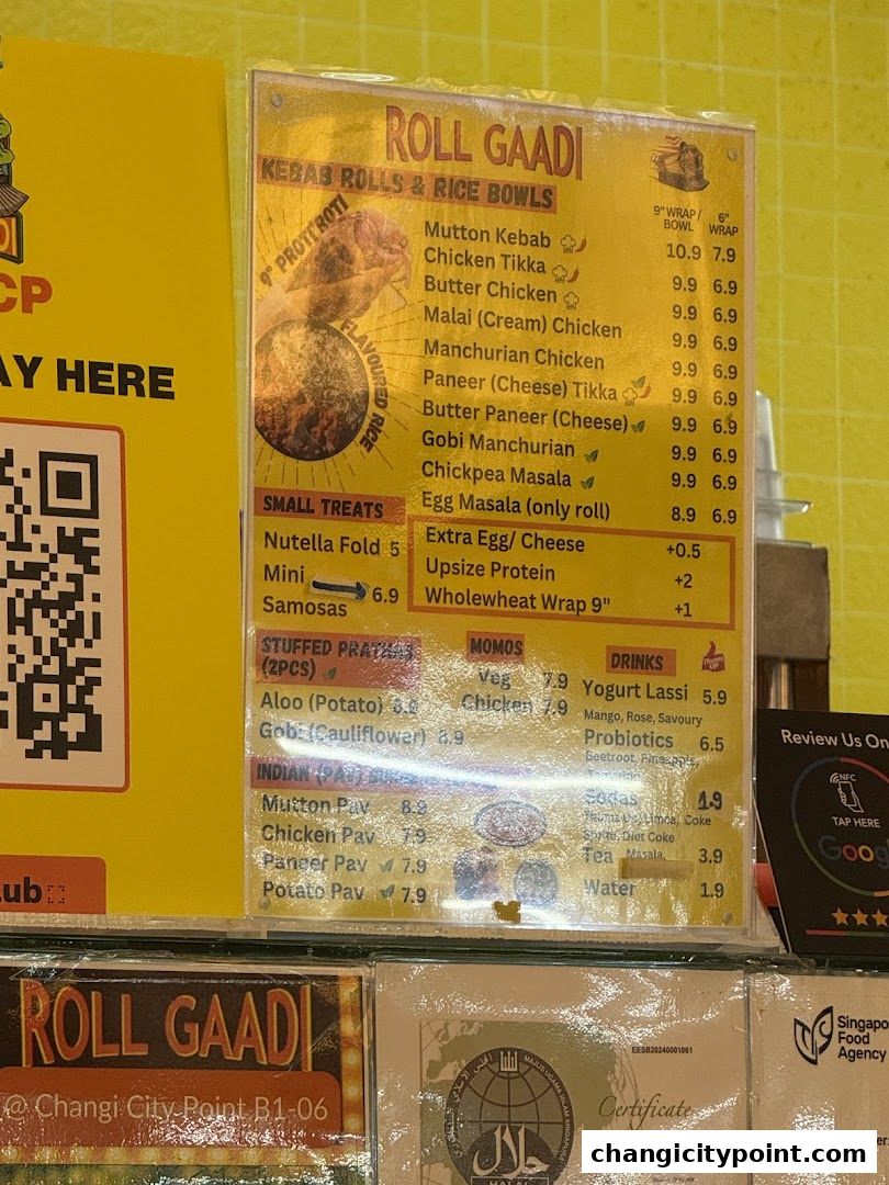 A menu board for Roll Gaadi, featuring kebab rolls, rice bowls, and drinks.