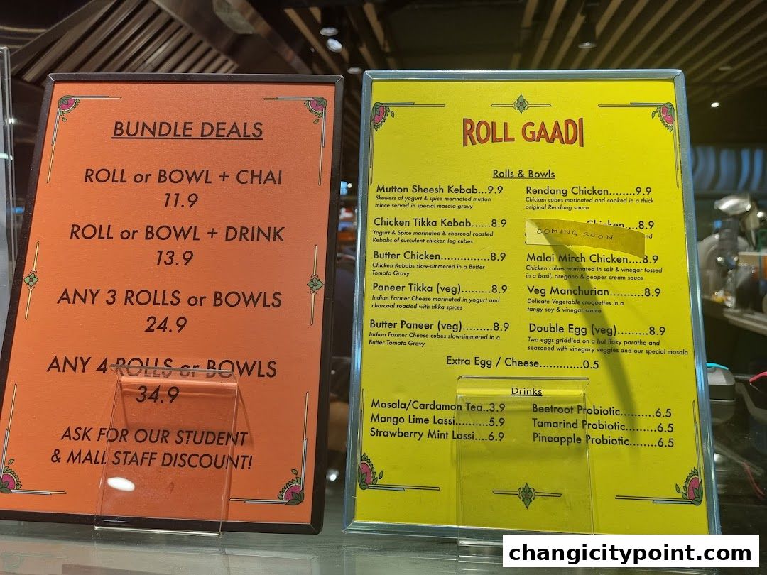 A menu board for Roll Gaadi, featuring bundle deals, rolls, bowls, and drinks.