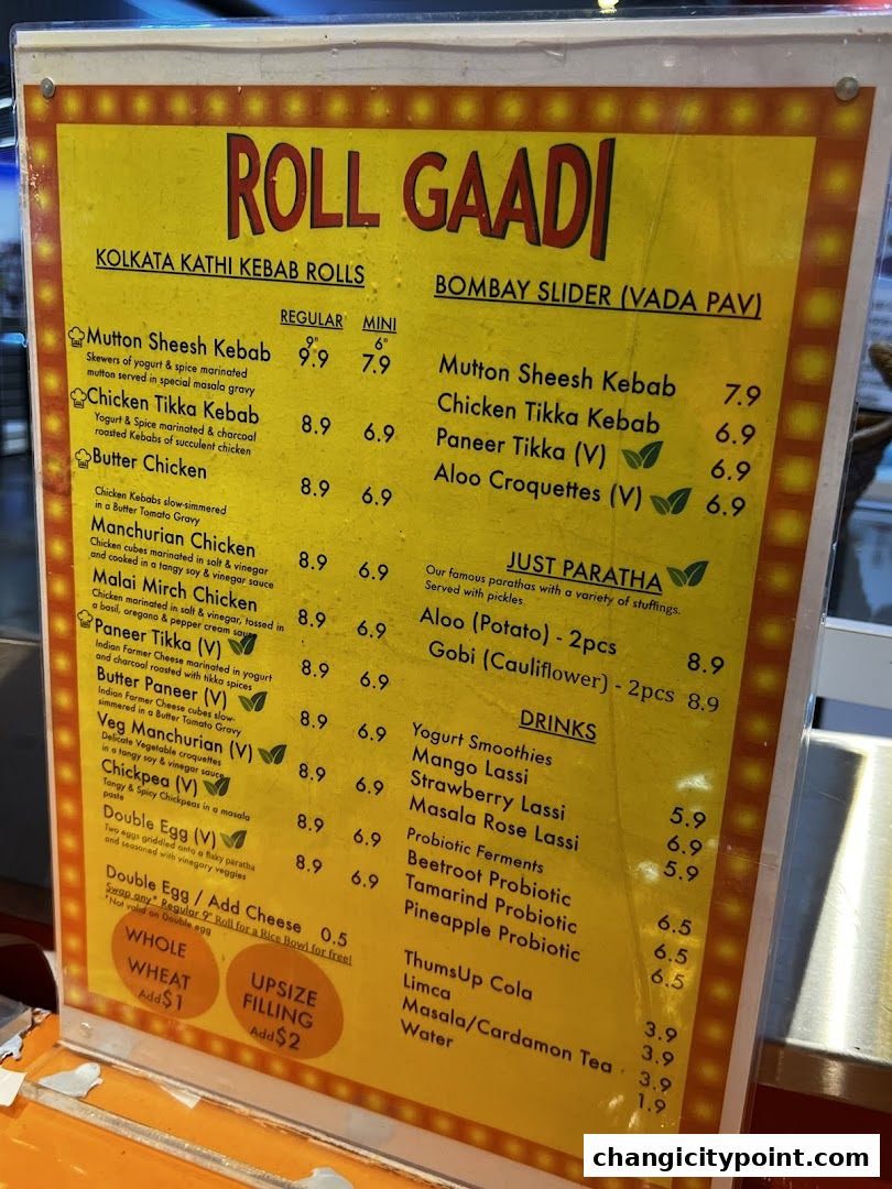 A menu board for RollGaadi, featuring Kolkata Kathi Kebab Rolls and Bombay Sliders.