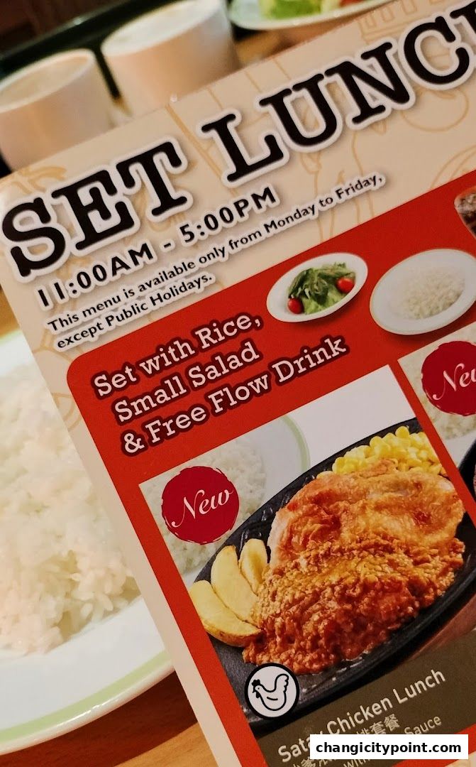 A menu featuring a 'Set Lunch' with Satay Chicken, rice, salad, and free-flow drink.