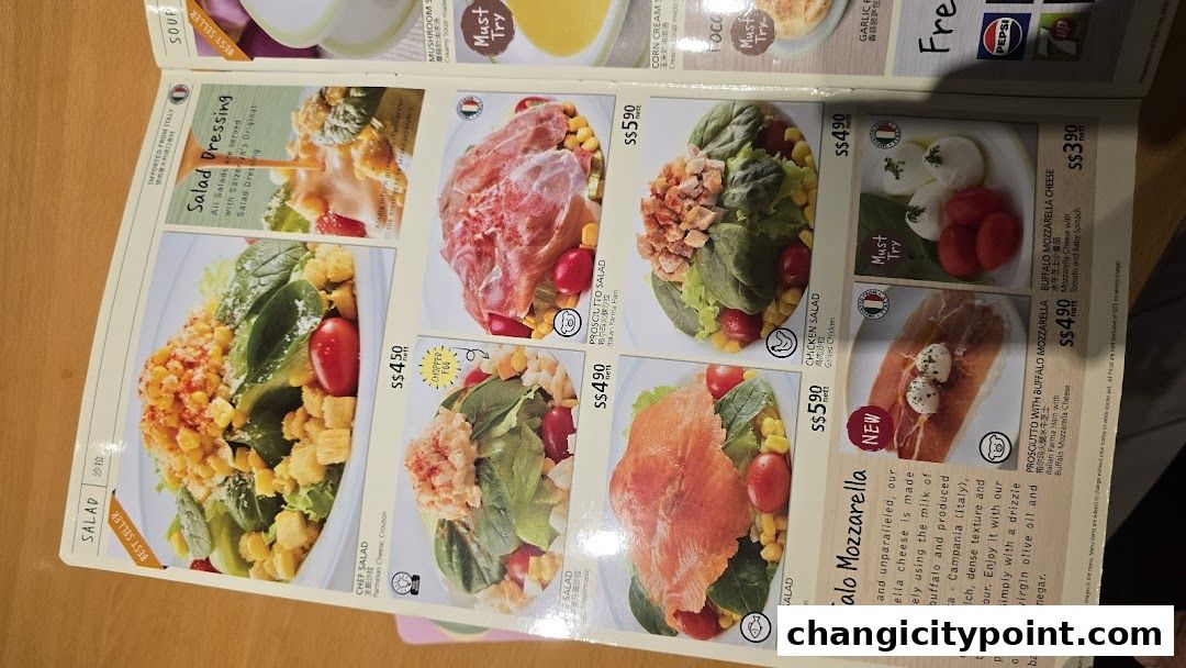 A menu page from Saizeriya featuring various salads and mozzarella dishes.
