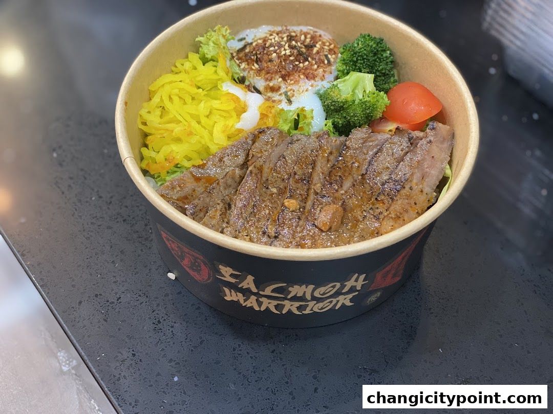 A bowl of rice with sliced steak, pickled vegetables, broccoli, and a fried egg.