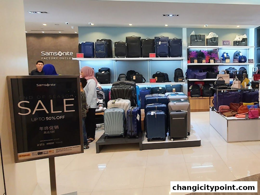 Samsonite Factory Outlet shop interior with luggage and a sale sign.