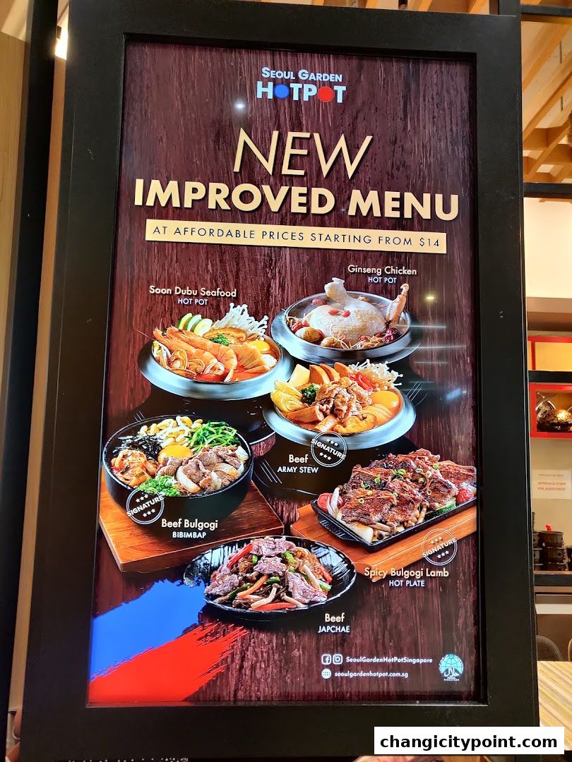 A menu board showcasing Seoul Garden Hot Pot's new improved menu with various Korean dishes.