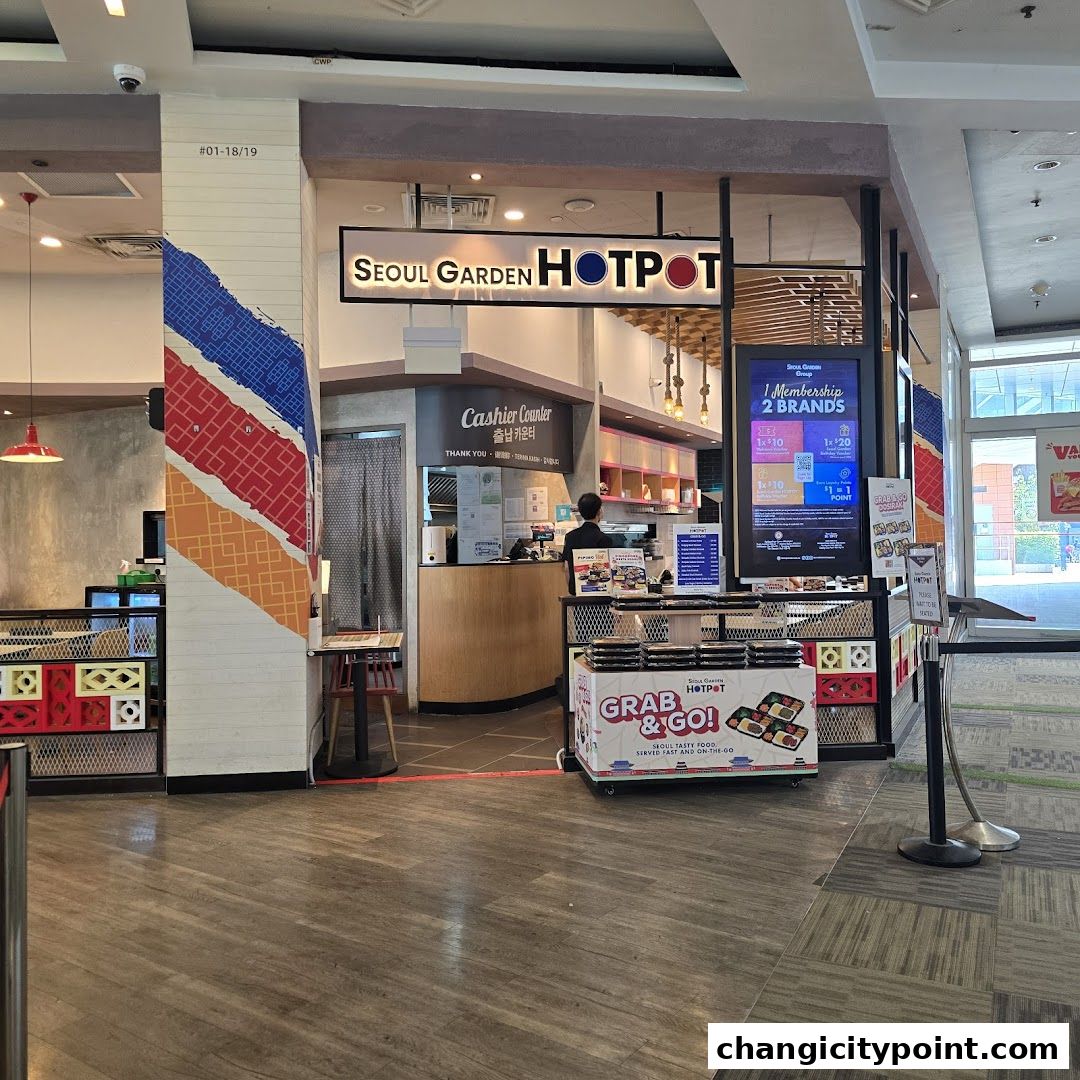 The entrance of Seoul Garden Hot Pot with a cashier counter and grab-and-go options.