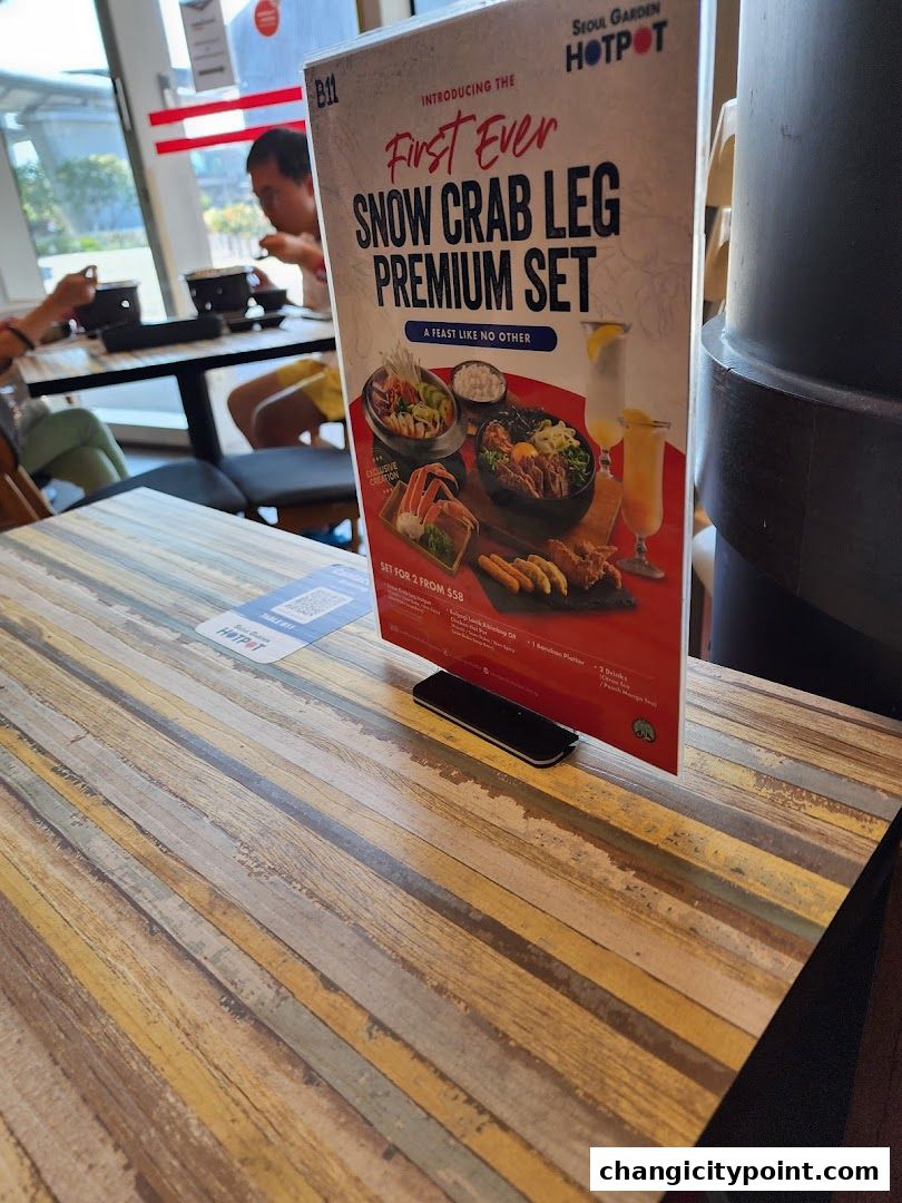 A menu stand for Seoul Garden Hot Pot's Snow Crab Leg Premium Set.