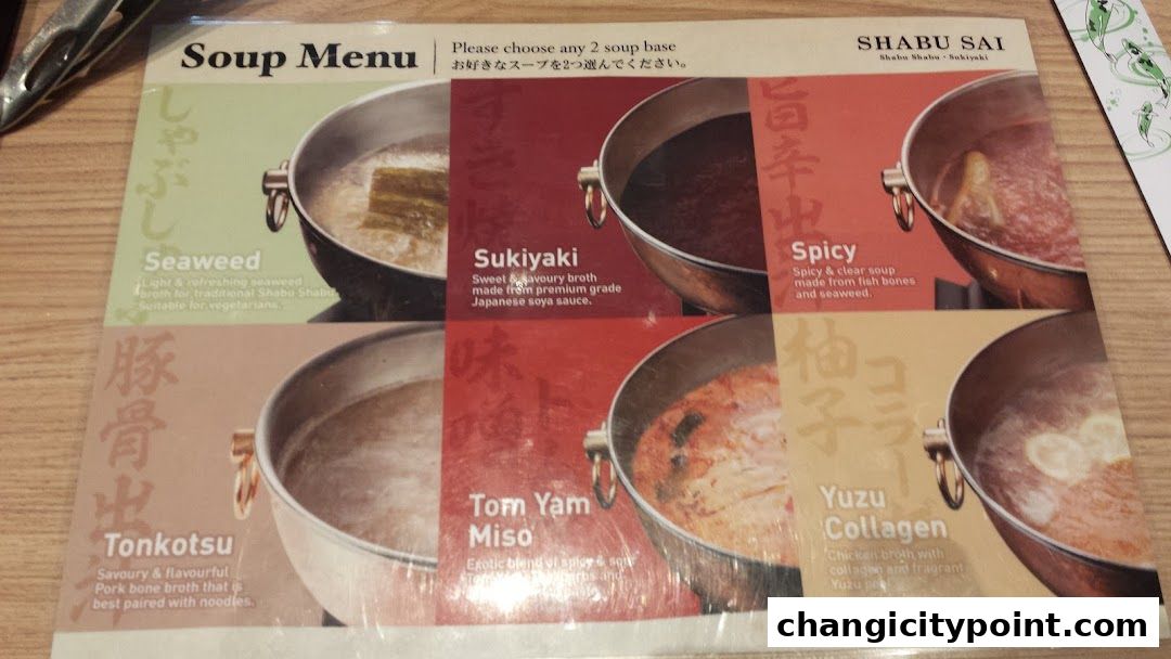 A menu displaying various soup bases for Shabu Sai, including Seaweed, Sukiyaki, Spicy, Tonkotsu, Tom Yam Miso, and Yuzu Collagen.