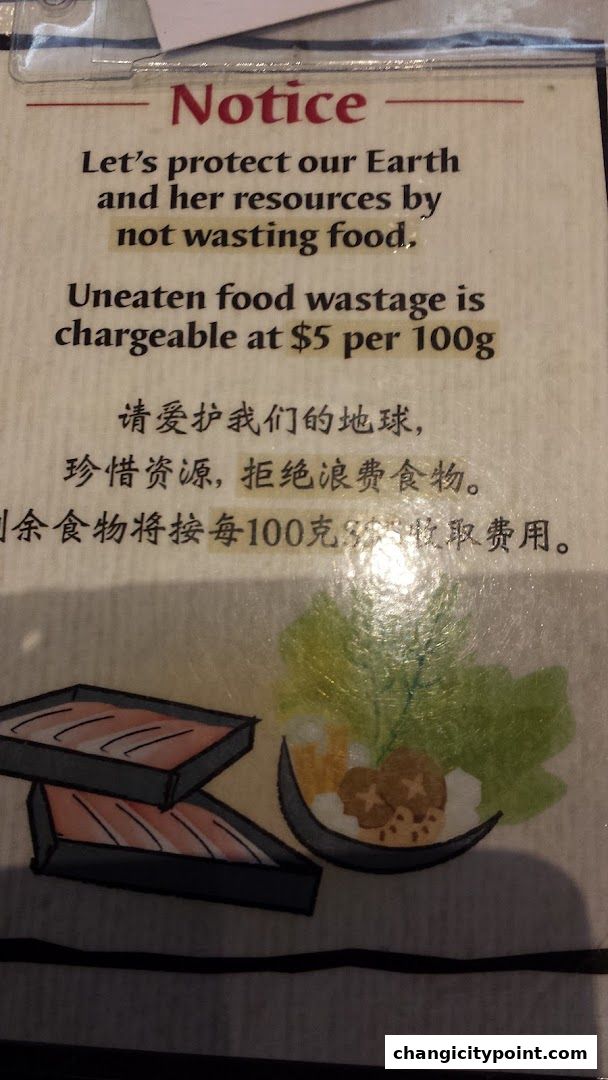 A notice about food wastage policy with a charge of $5 per 100g.