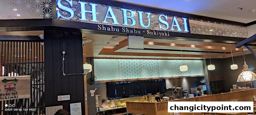 The exterior of Shabu Sai, a Shabu Shabu and Sukiyaki restaurant, with its prominent signage.