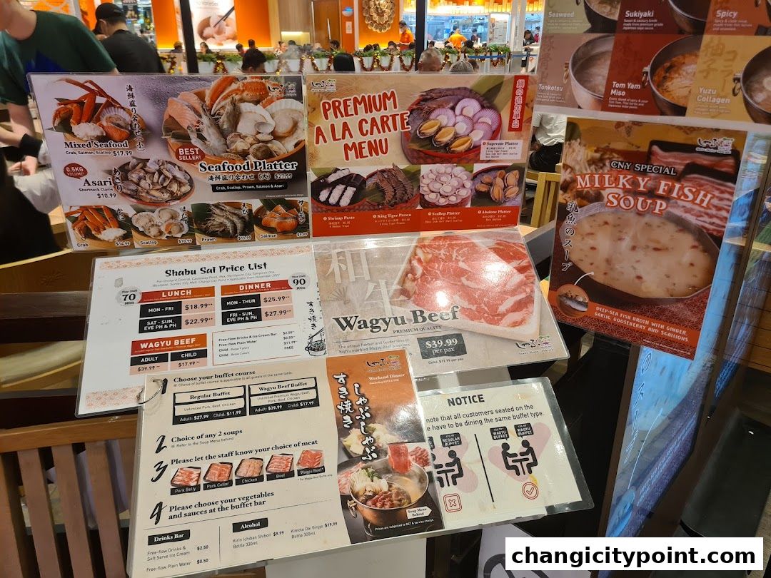 A display of Shabu Sai's menu items, including seafood platters, wagyu beef, and soup options.