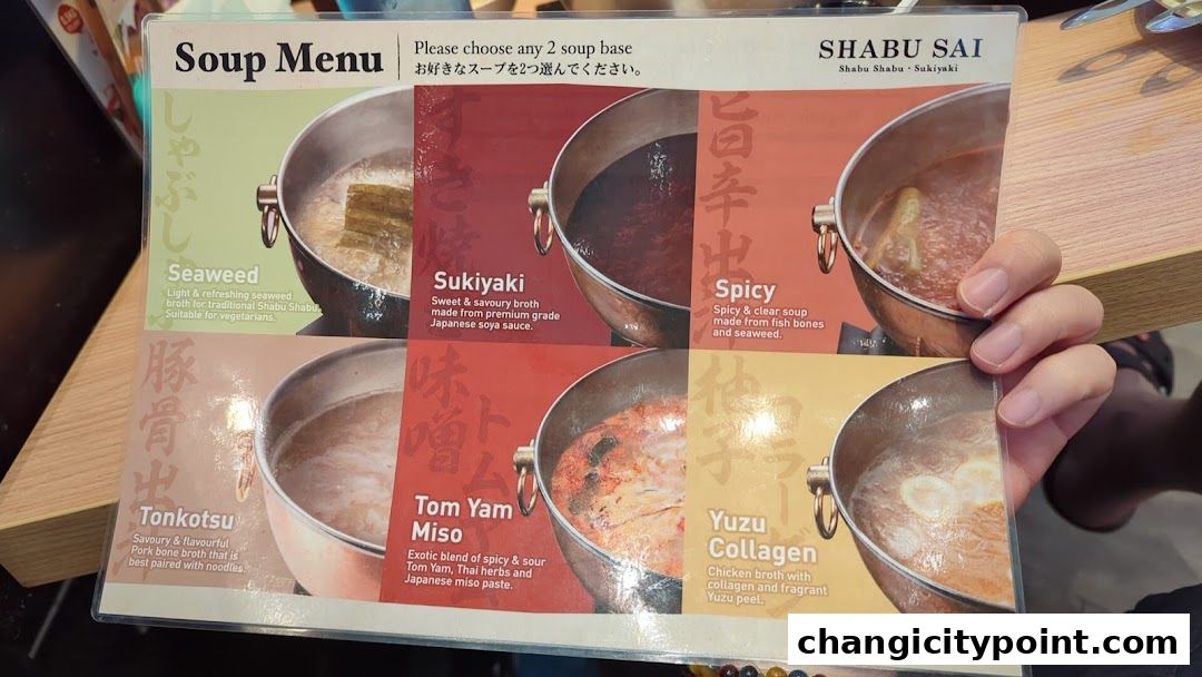 A menu displaying various soup bases for Shabu Sai, including Seaweed, Sukiyaki, Spicy, Tonkotsu, Tom Yam Miso, and Yuzu Collagen.