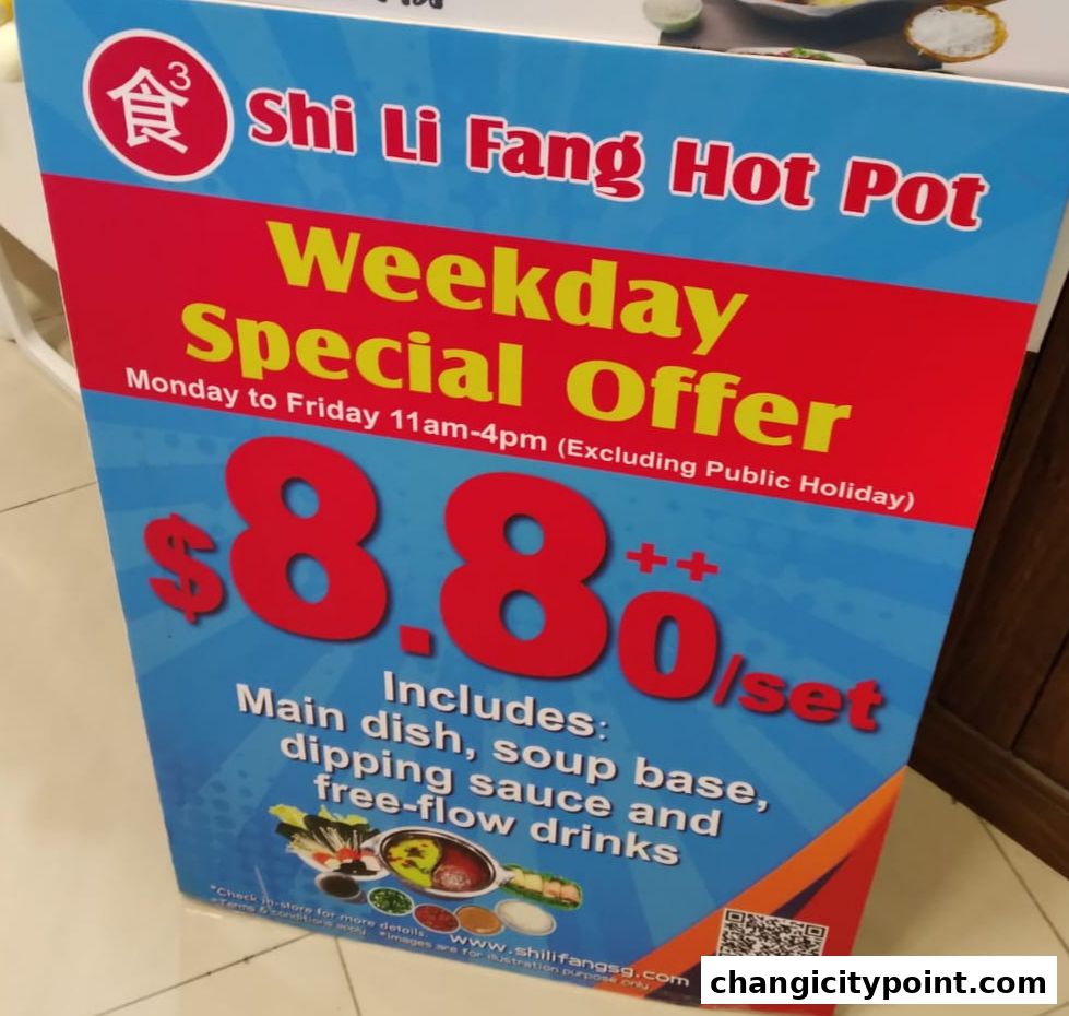 A sign advertising Shi Li Fang Hot Pot's weekday special offer.