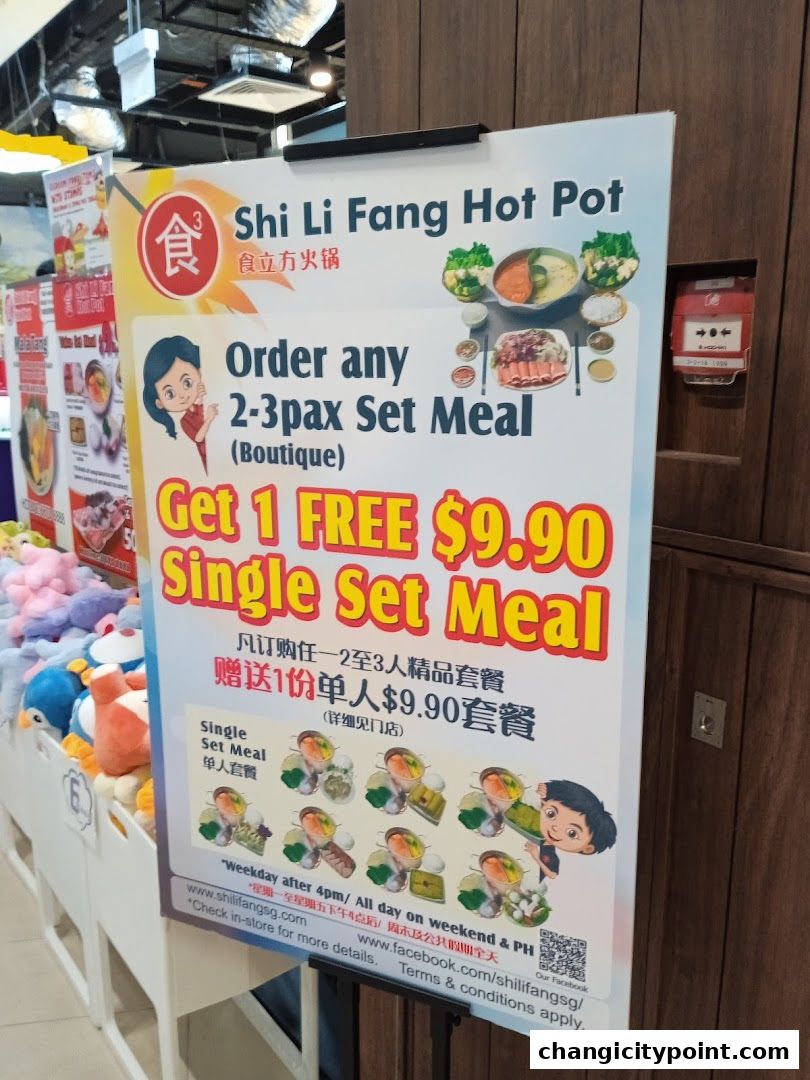 A promotional poster for Shi Li Fang Hot Pot offering a free single set meal with a 2-3 pax set meal purchase.