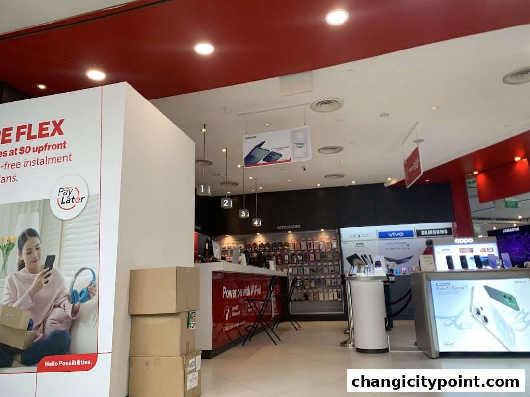 Interior view of a Singtel Exclusive Retailer shop showcasing mobile phones and accessories.