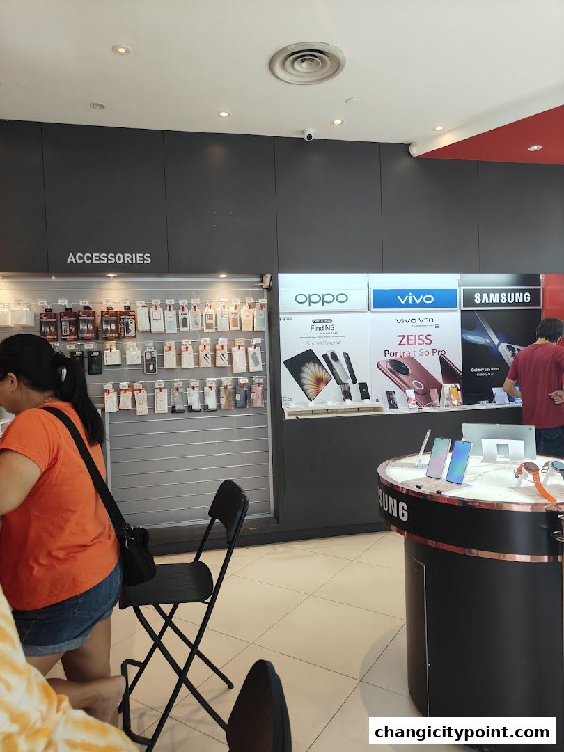 Interior of a Singtel Exclusive Retailer shop showcasing mobile phones and accessories.