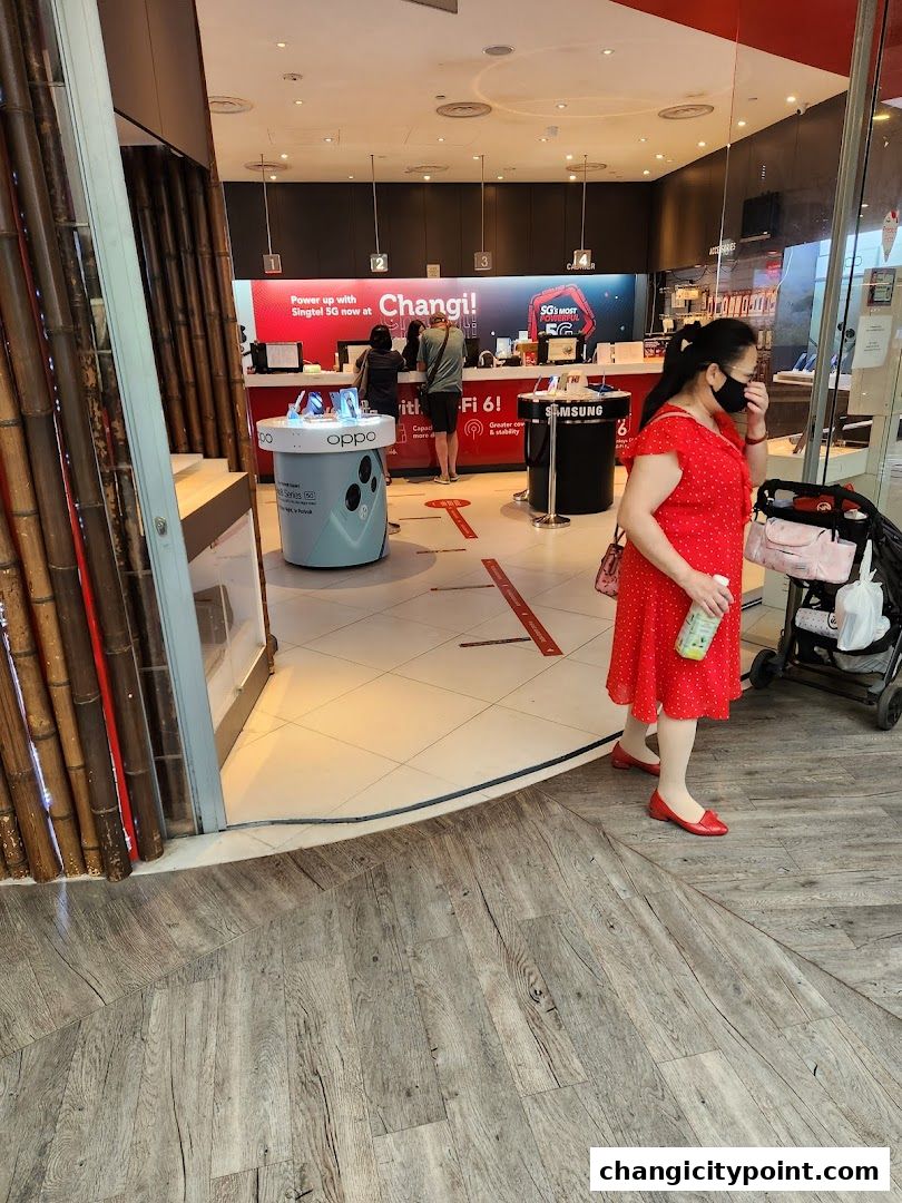 Interior view of a Singtel Exclusive Retailer shop with customers and displays.