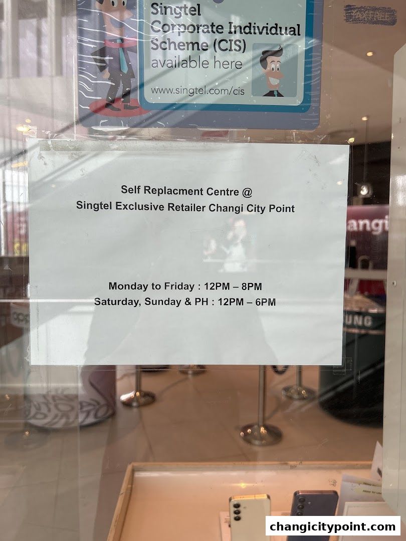 Signage for Singtel Self Replacement Centre at Changi City Point with operating hours.